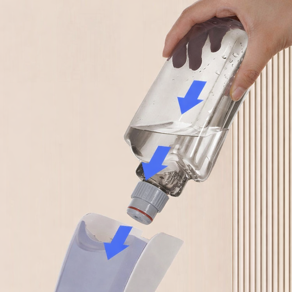 Zidello heavy-duty spray mop with refillable water bottle and flat microfiber mop head spraying cleaning solution on a wooden floor for easy home floor cleaning.